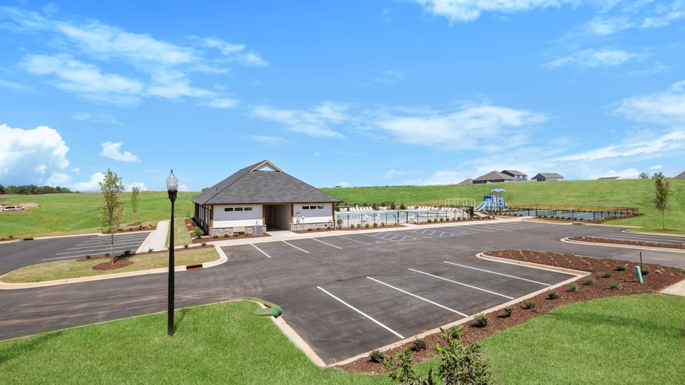 Amenity center with parking lot.