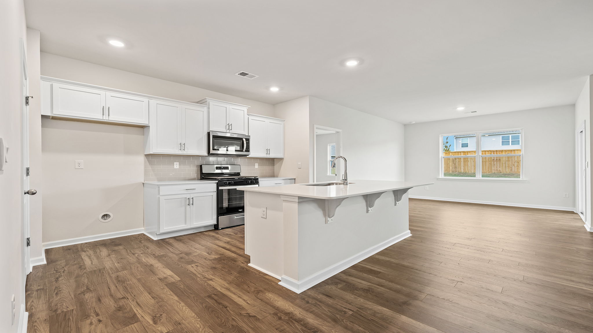 Kitchen with island and quartz