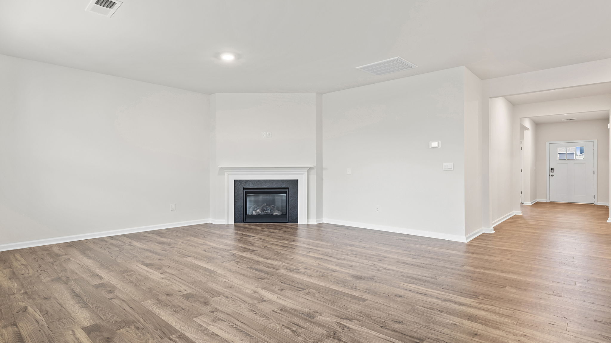 Family room with gas log fireplace.