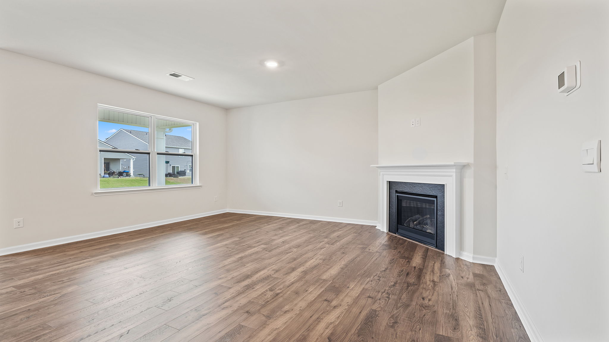 Family room with gas log fireplace.