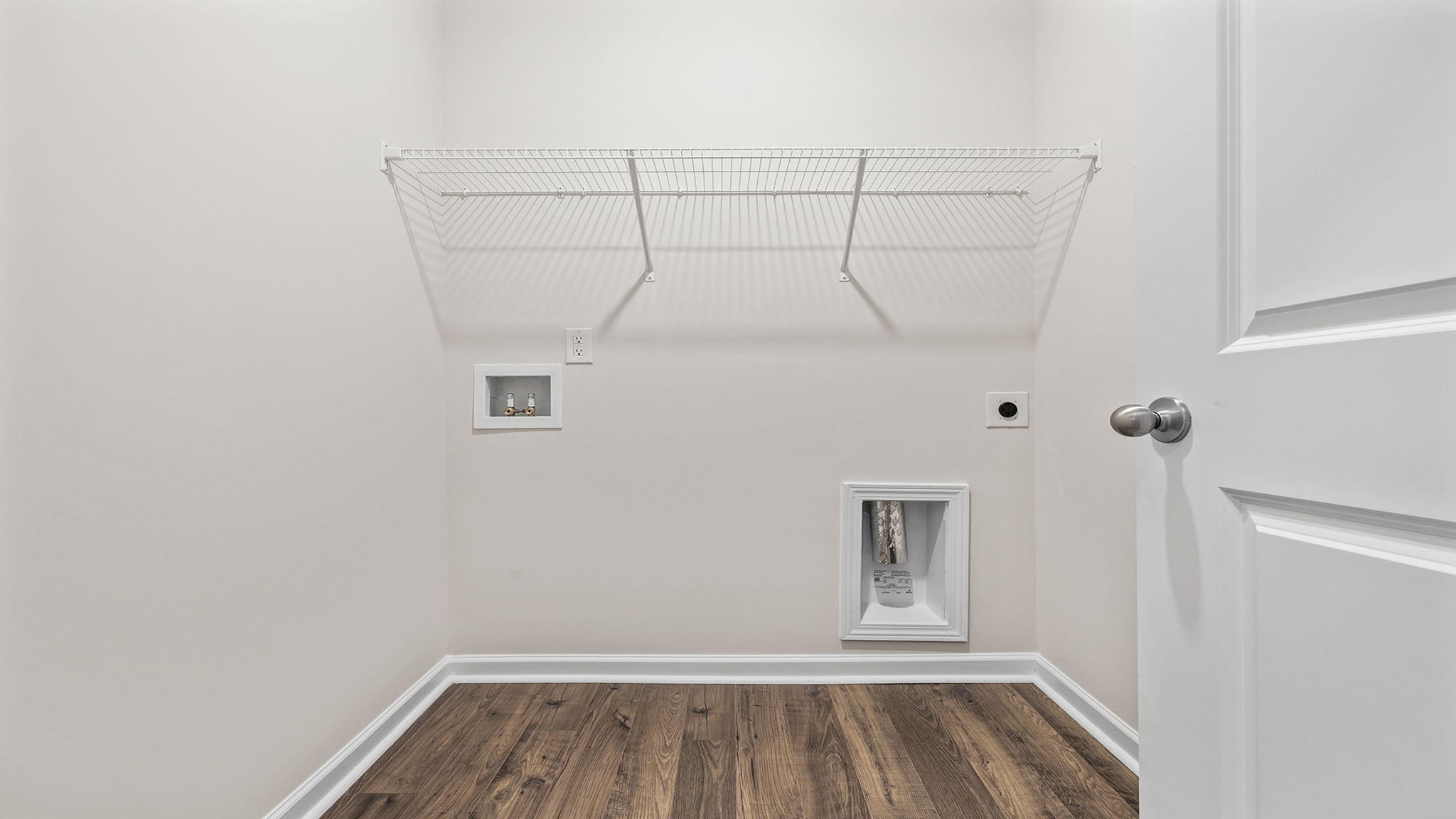 Laundry room with shelving.