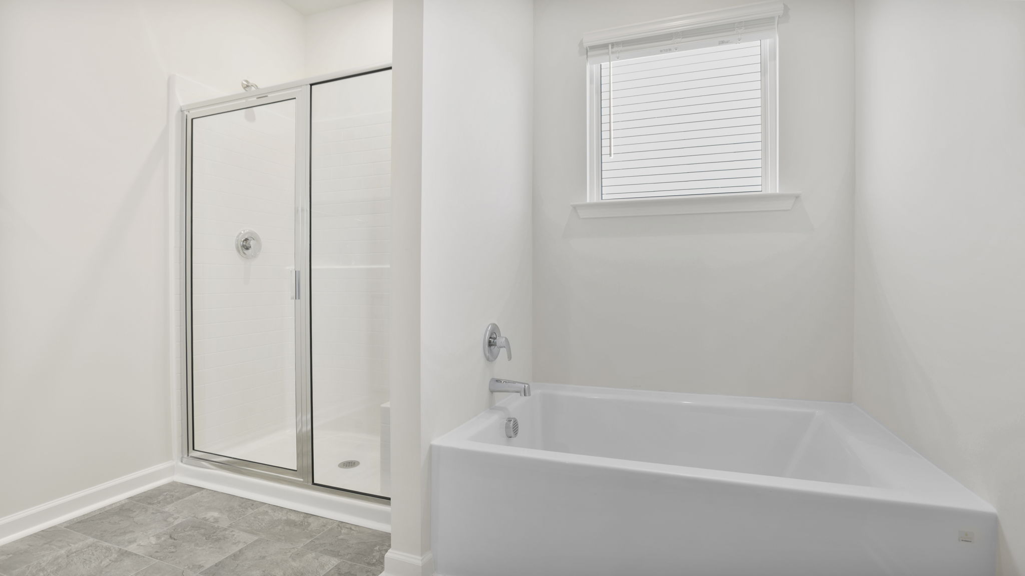 Primary bathroom has garden tub and walk-in shower.