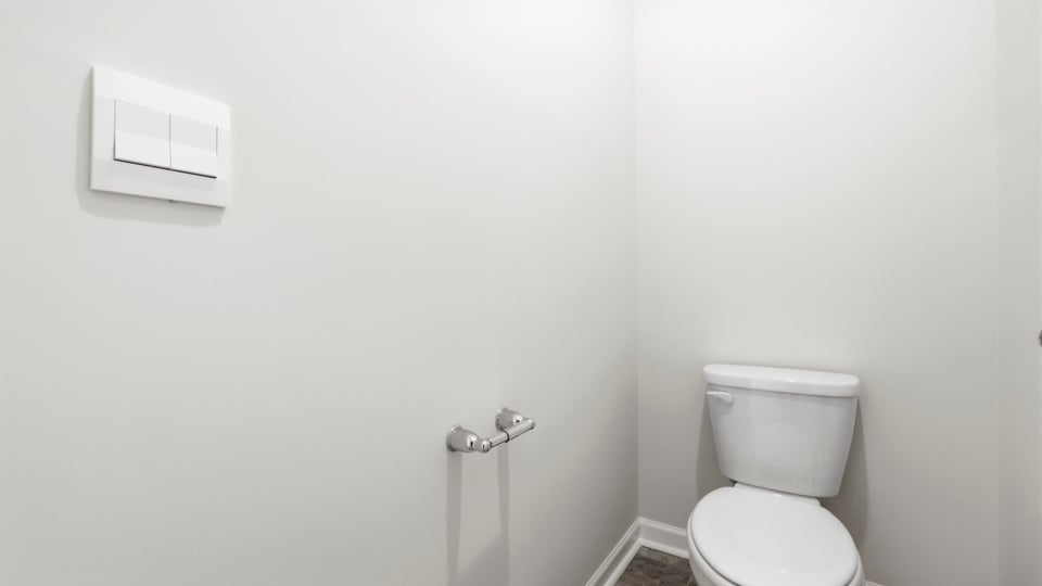 Bathroom with double vanity sink and walk in shower.