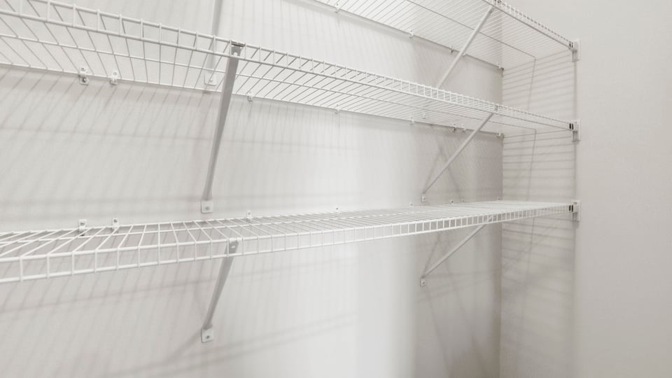 Closet with hanging storage racks.