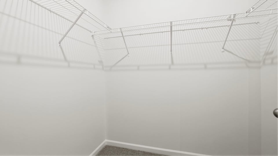 Closet with hanging storage racks.