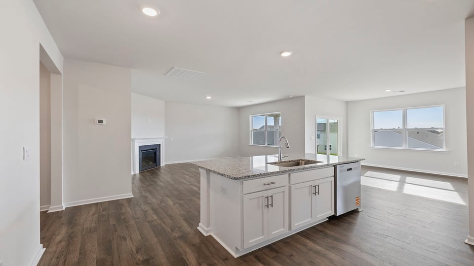 Kitchen with island and cabinets.