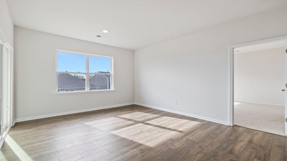 Living area with fireplace and windows.a