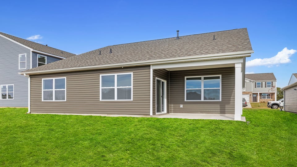 Back exterior with large backyard.