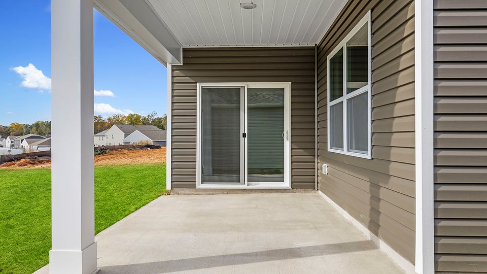 Back exterior with large backyard.