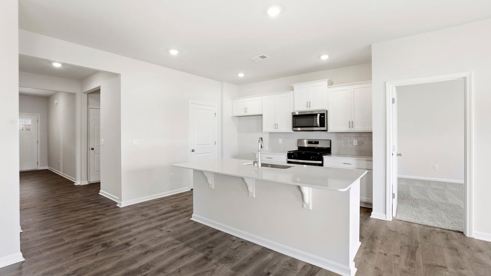 Kitchen with island and cabinets.