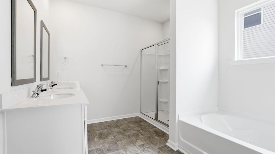 Primary bathroom with double vanity sinks.