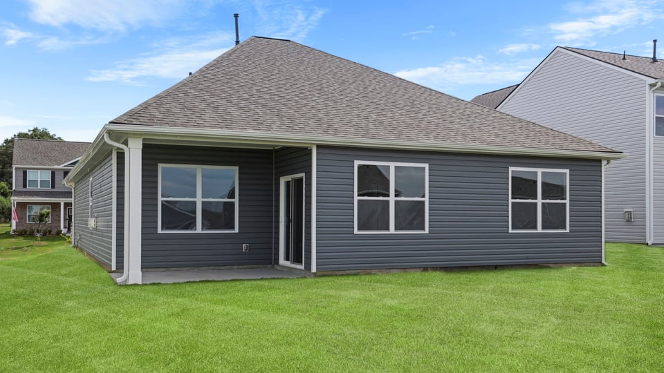 Back exterior with large backyard.