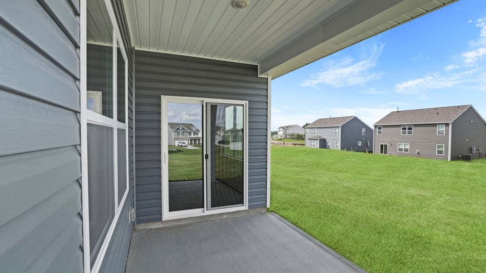 Back exterior with large backyard.