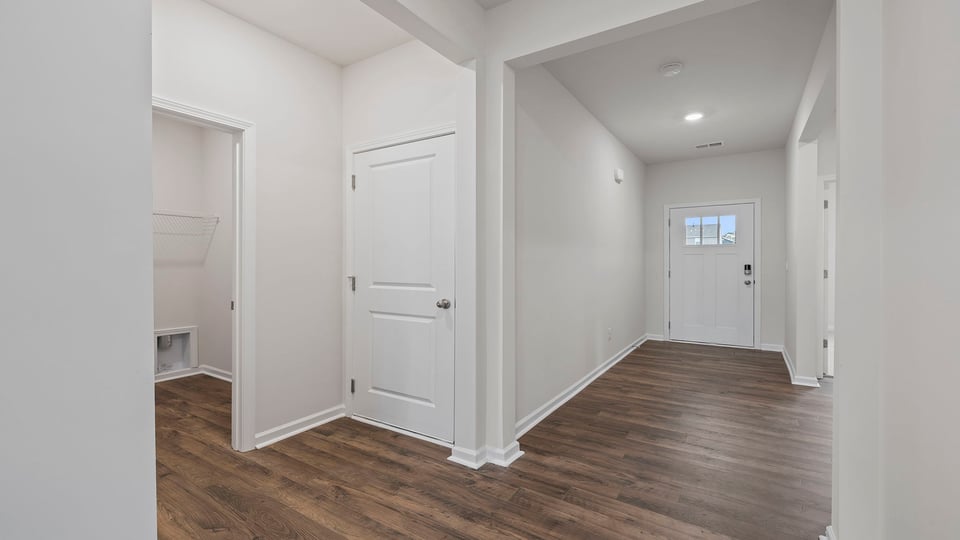 View of hallway and location of the laundry room.