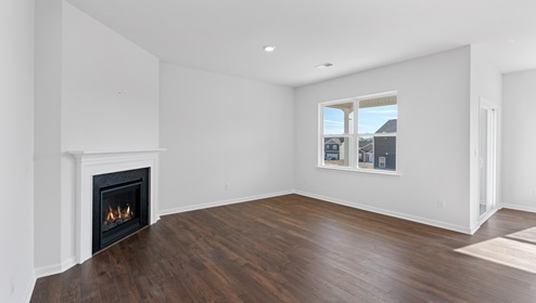 Family room with windows and fireplace.