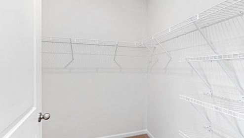 Closet with hanging storage racks.