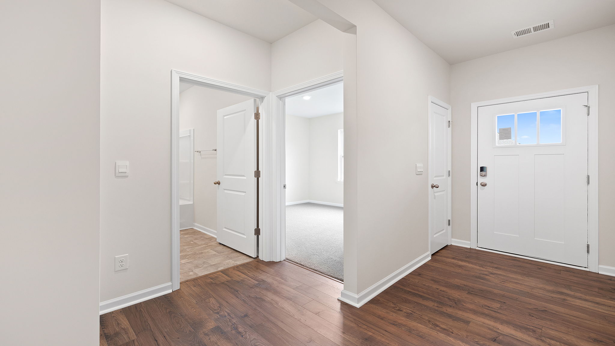 View of foyer and front bedroom entrance.