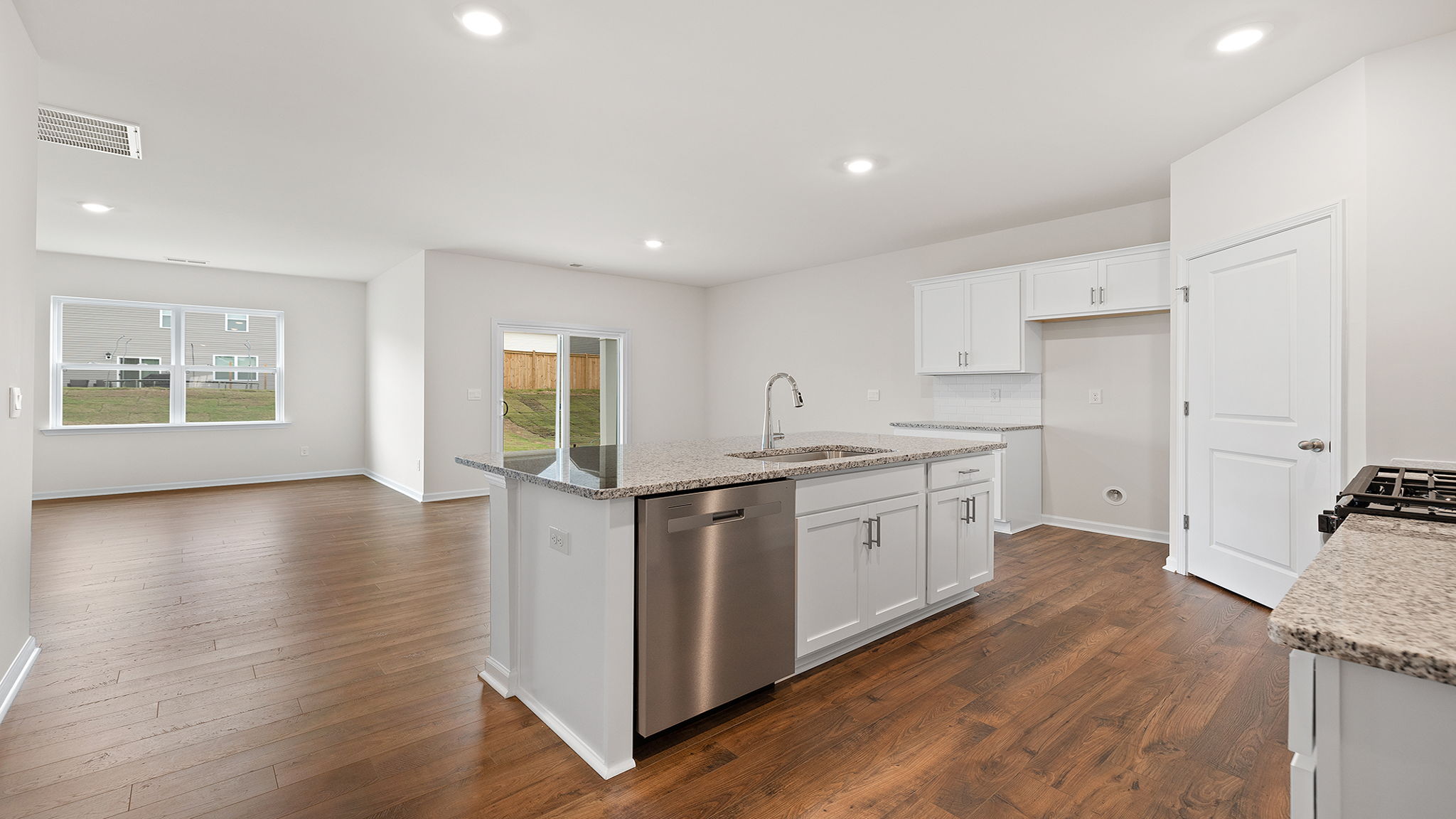 View from kitchen of the combination living and dining areas.