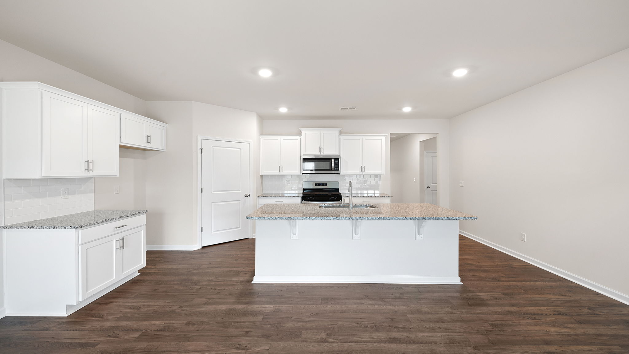Full view of kitchen with quartz countertops.