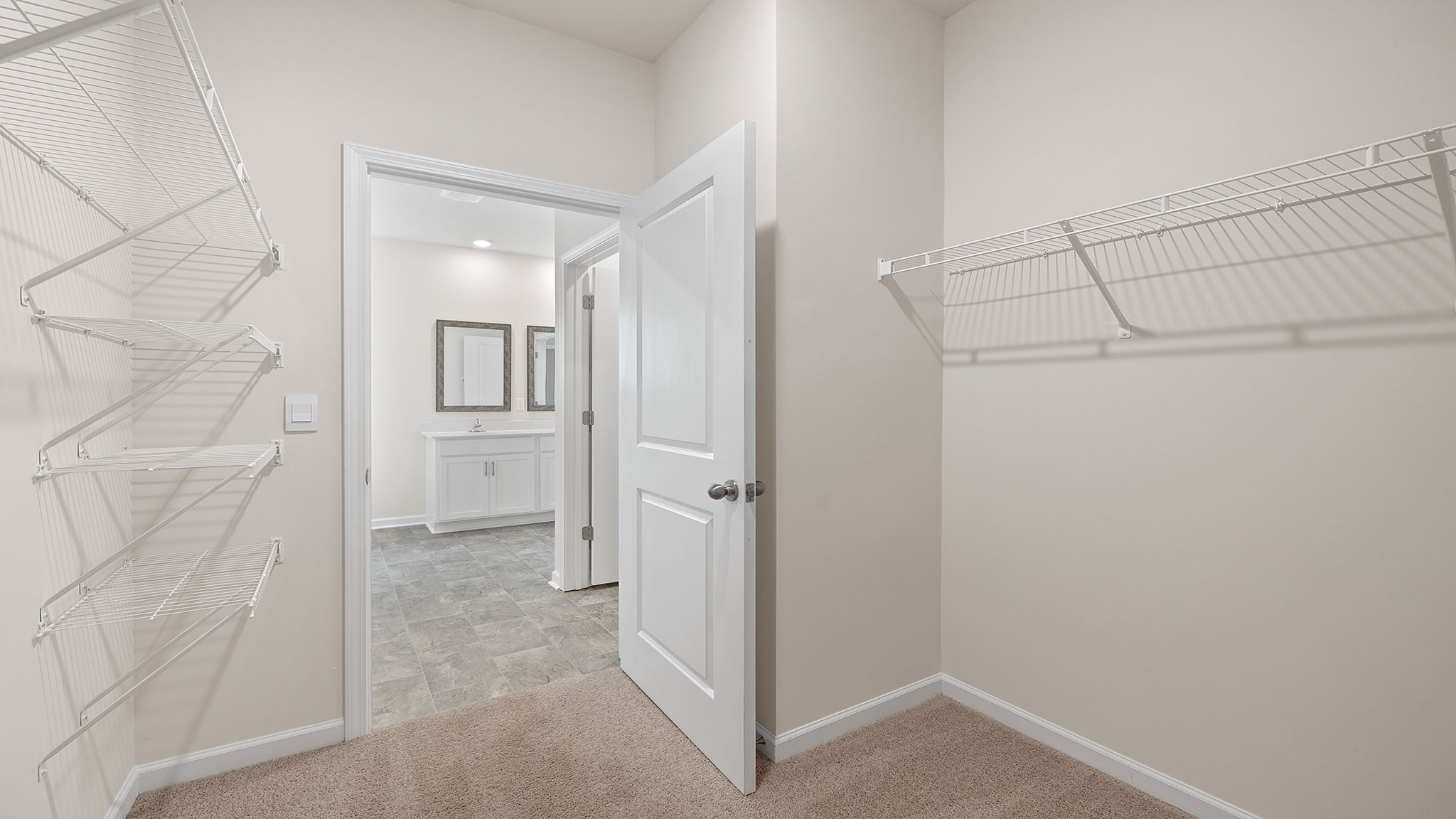 Primary bedroom walk-in closet.