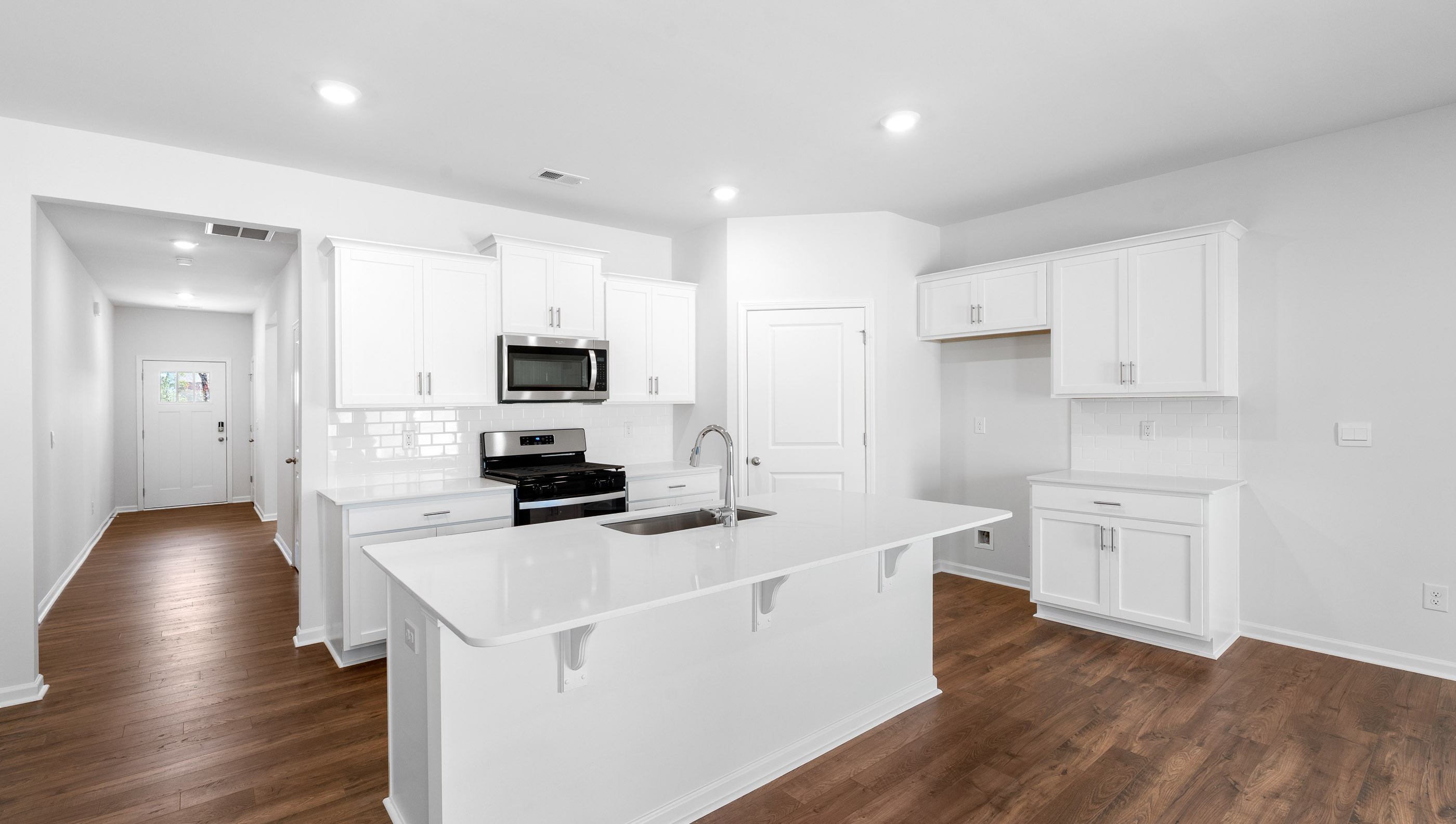Kitchen with island and granite counter tops.