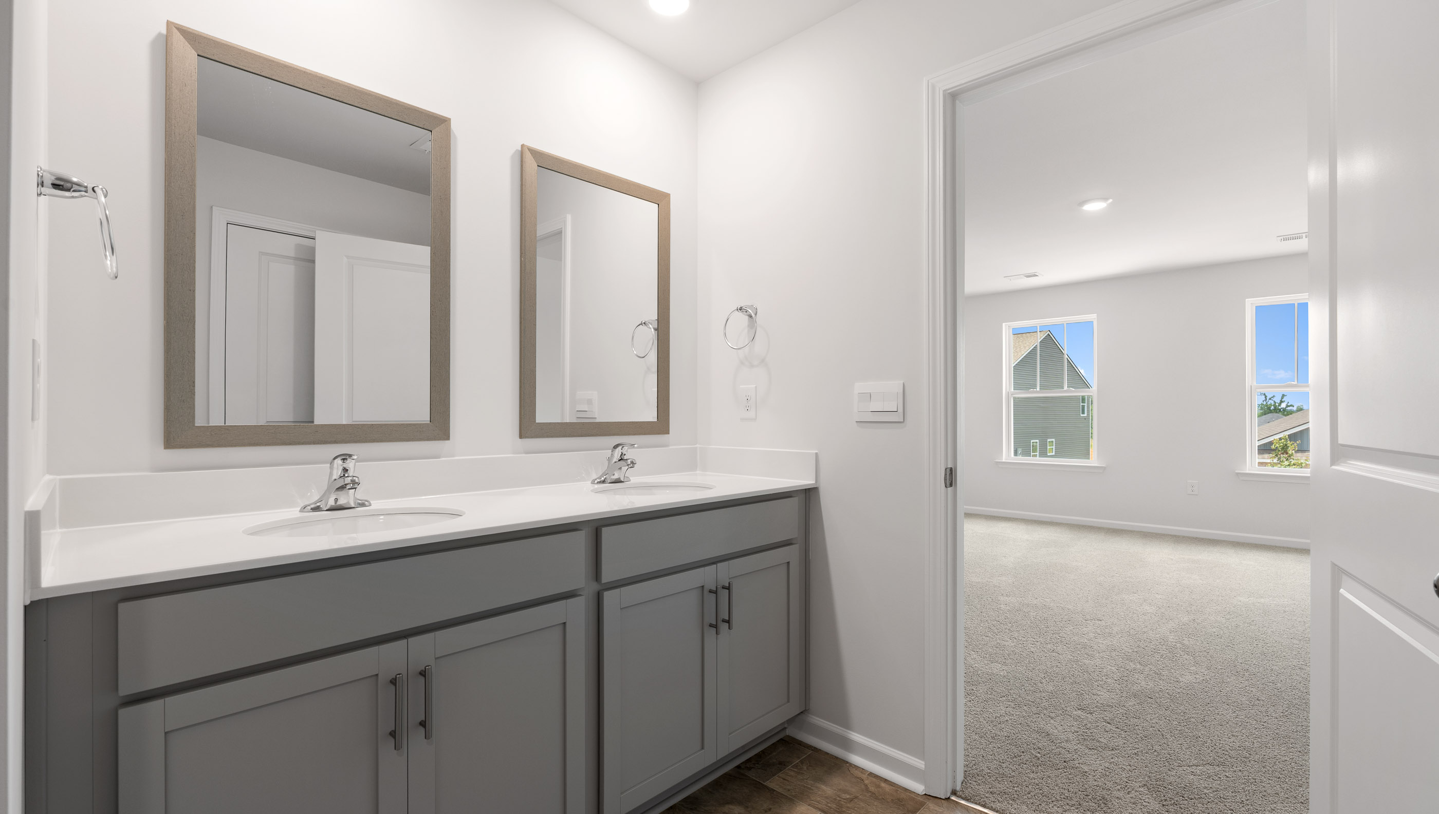 Primary bathroom with dual sink vanity.