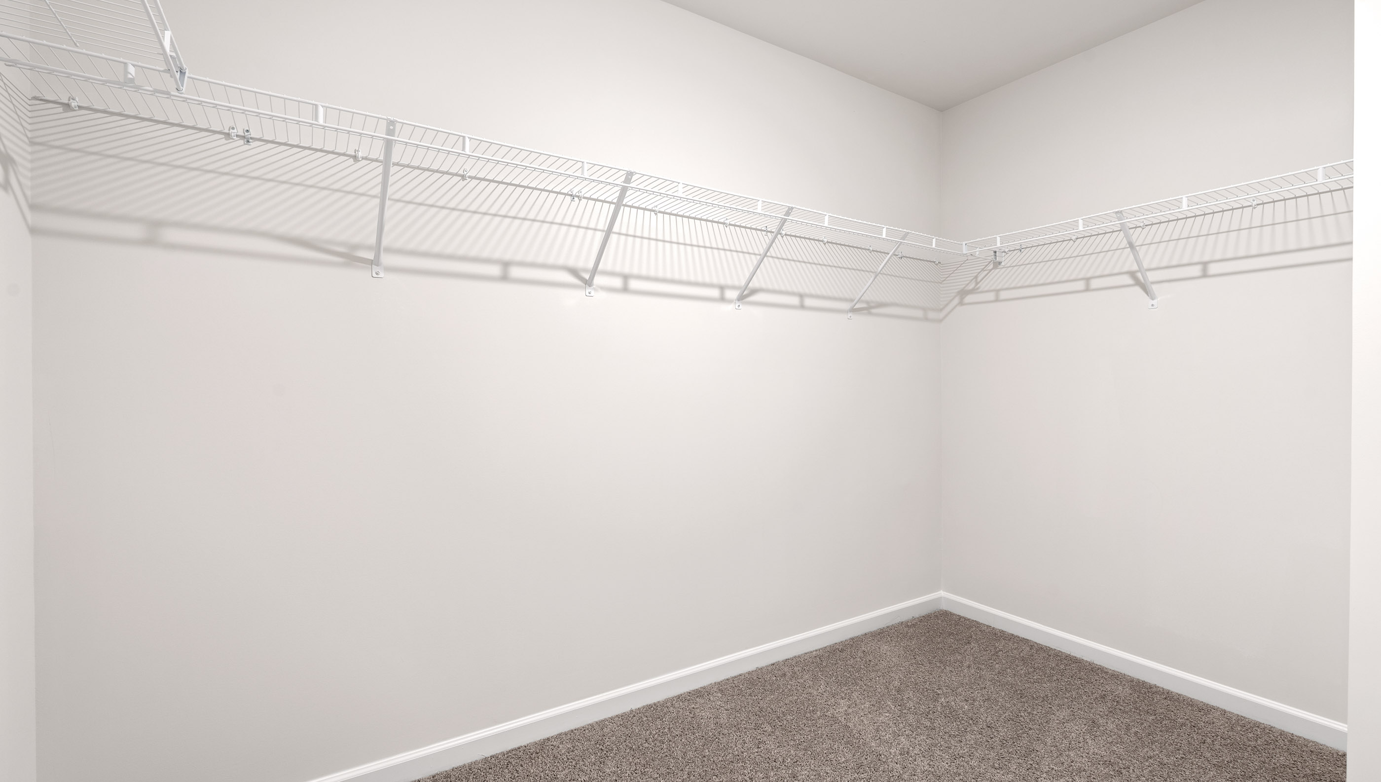 Primary bedroom walk-in closet.