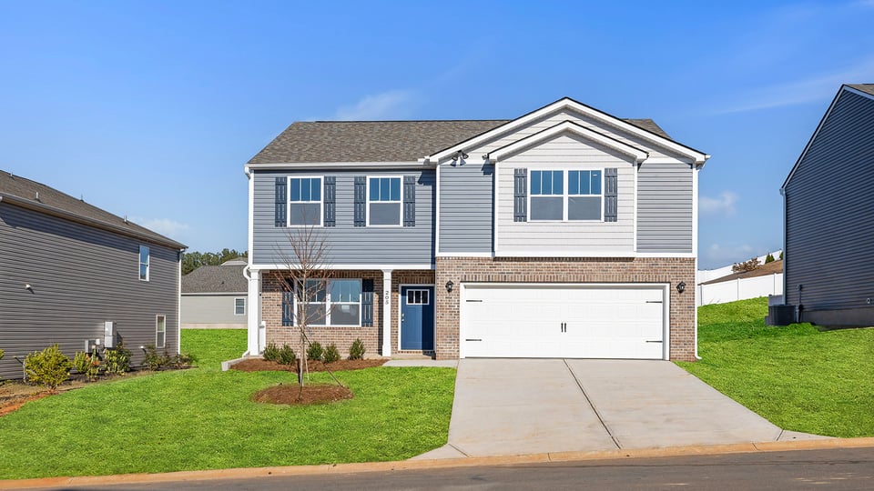 Front exterior of Penwell with 2 car garage.