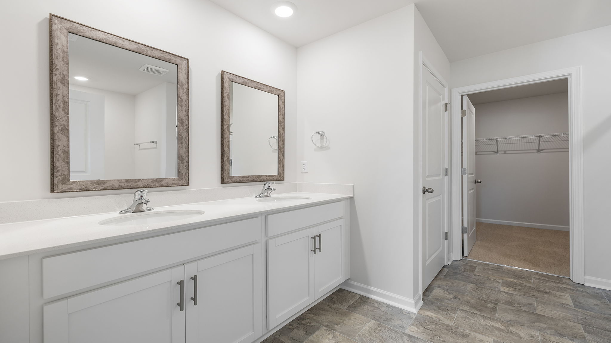 Primary bathroom with dual sink vanity.