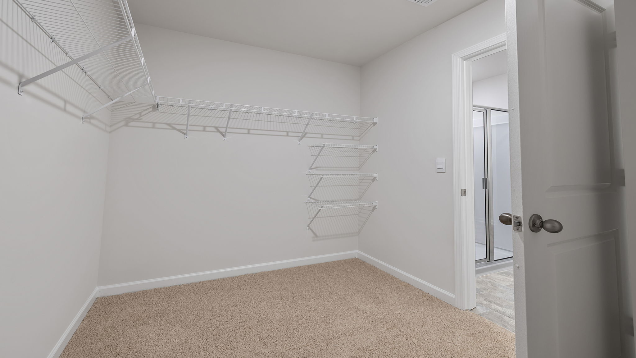 Primary bedroom walk-in closet.