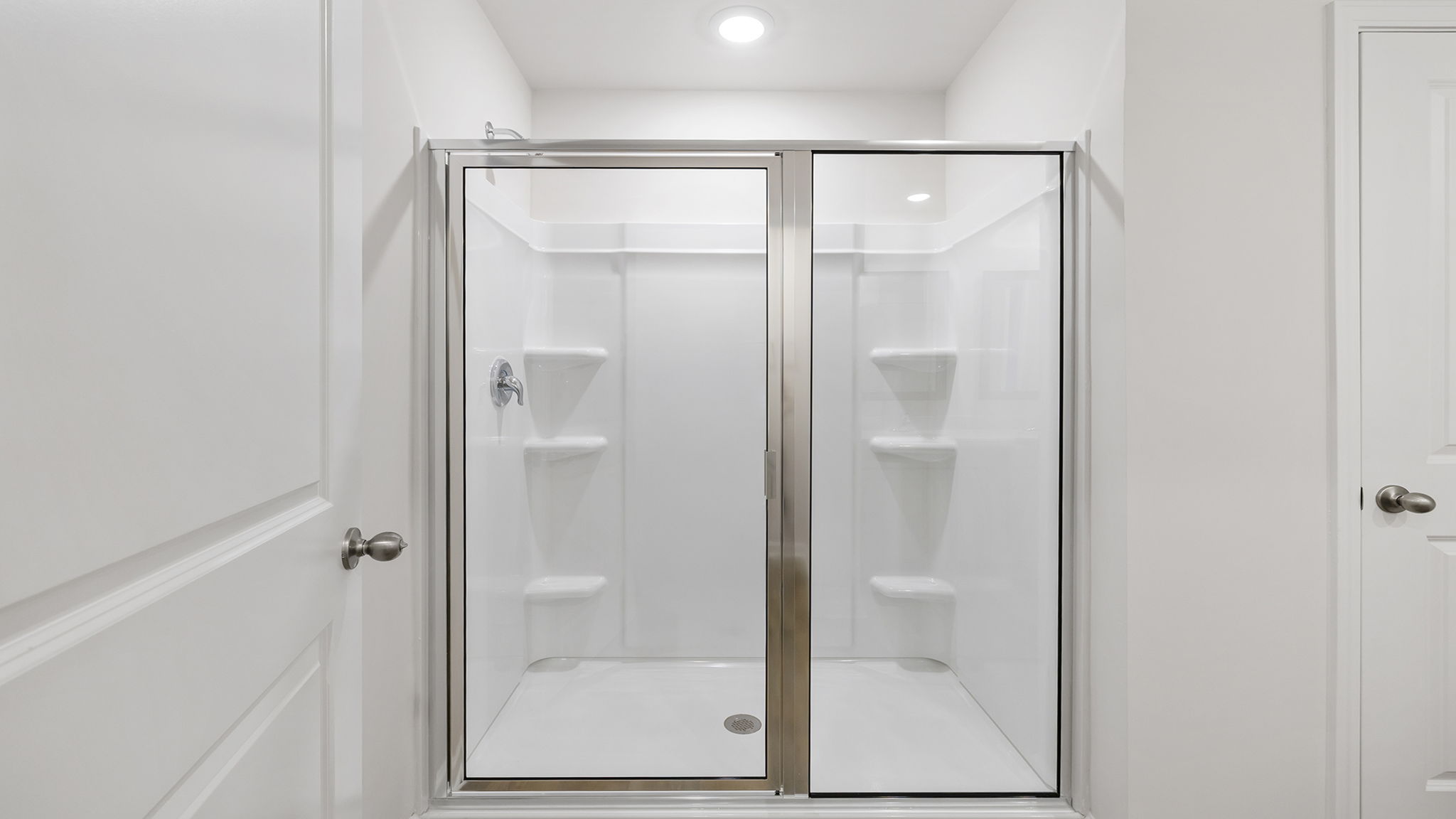 Primary bathroom with walk-in shower.