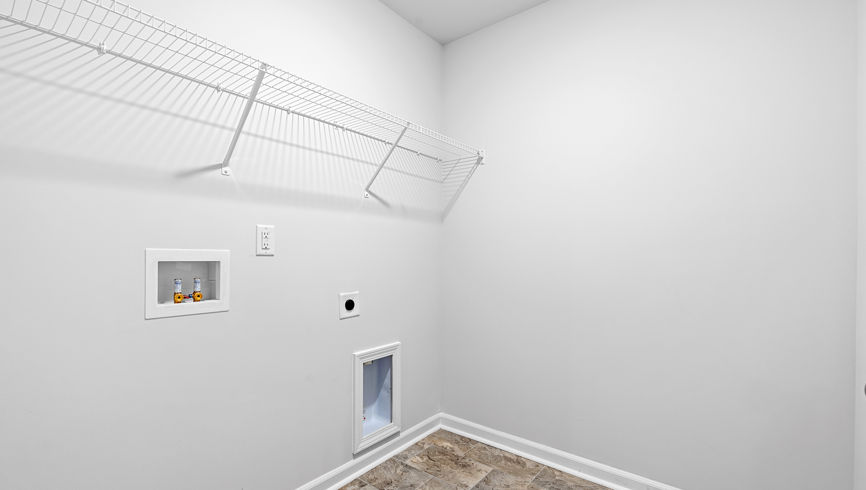 Walk-in laundry room.