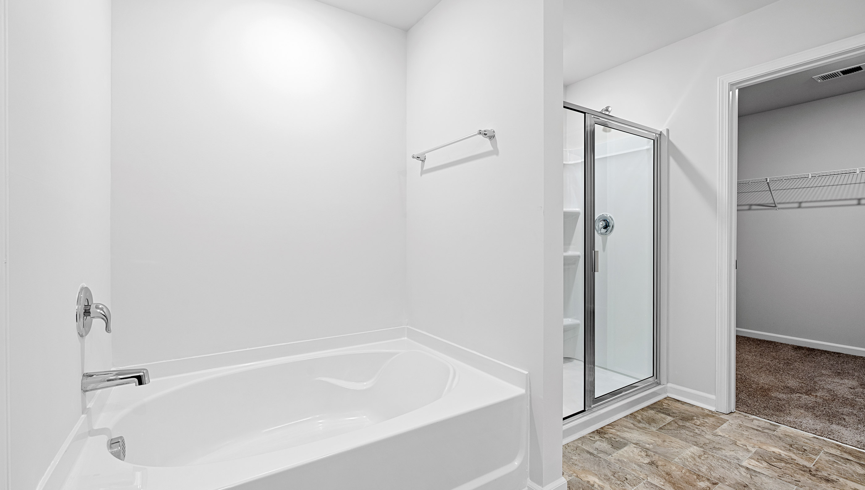 Primary bathroom with walk-in shower, garden tub is optional.