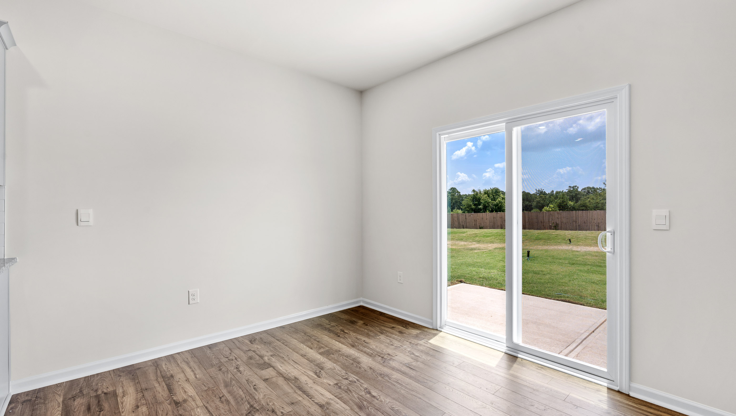View of dining area and doors to the outside patio..