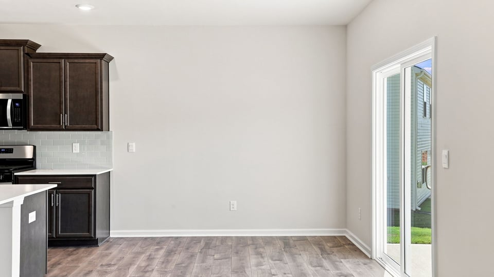 Living room with window and fireplace.