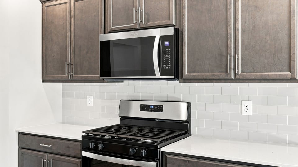 Kitchen with island and cabinets.