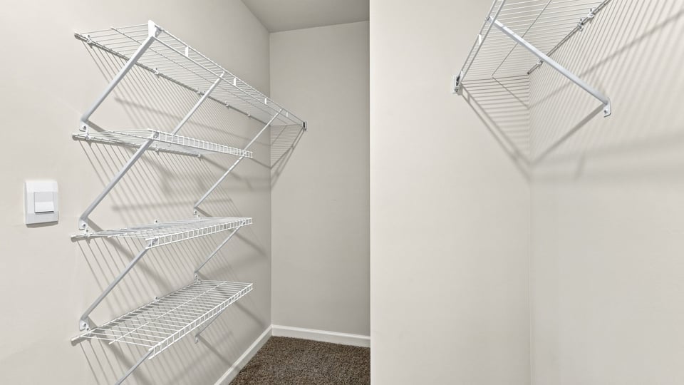Primary closet with shelf.