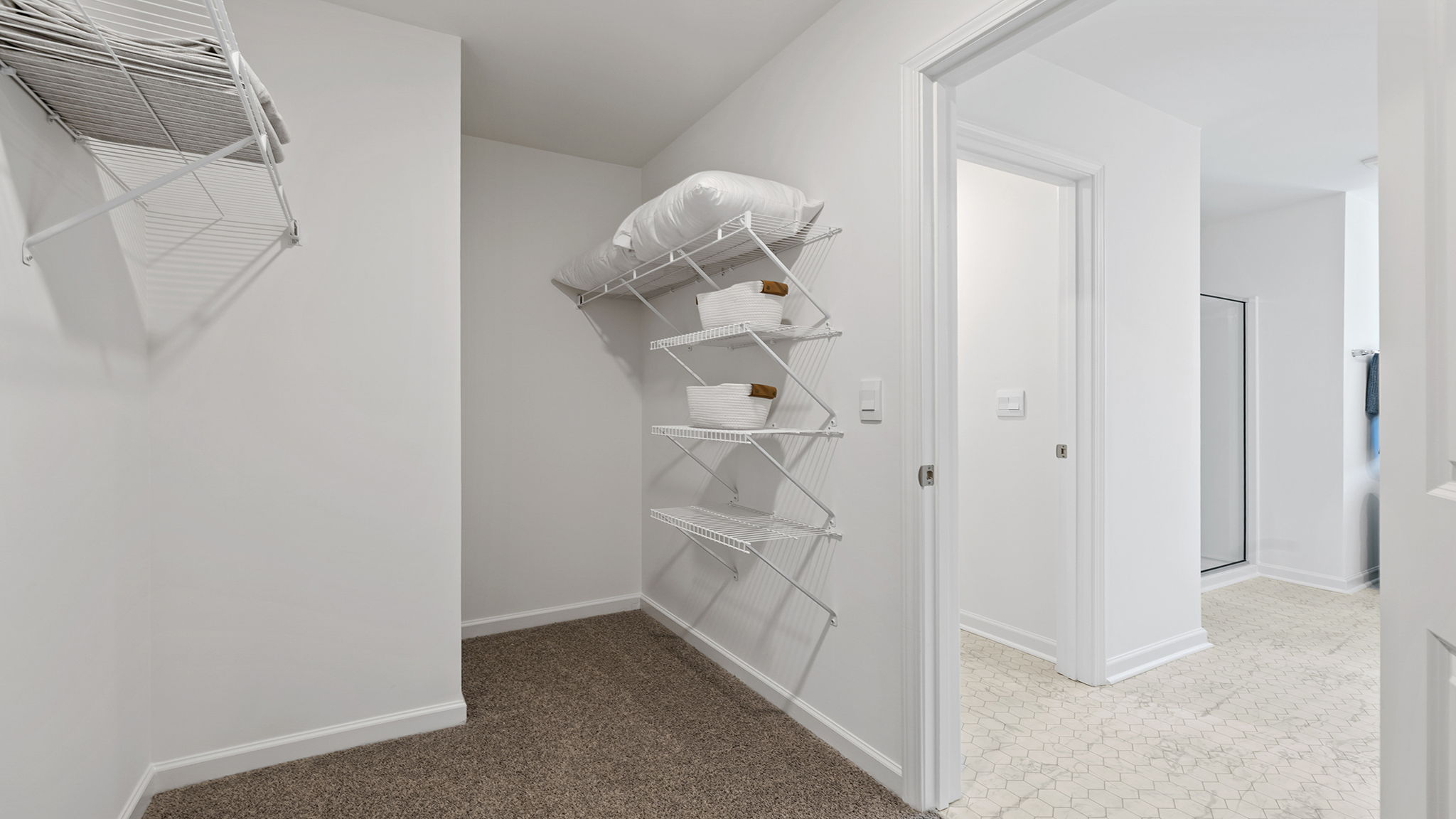 Primary closets with shelf.