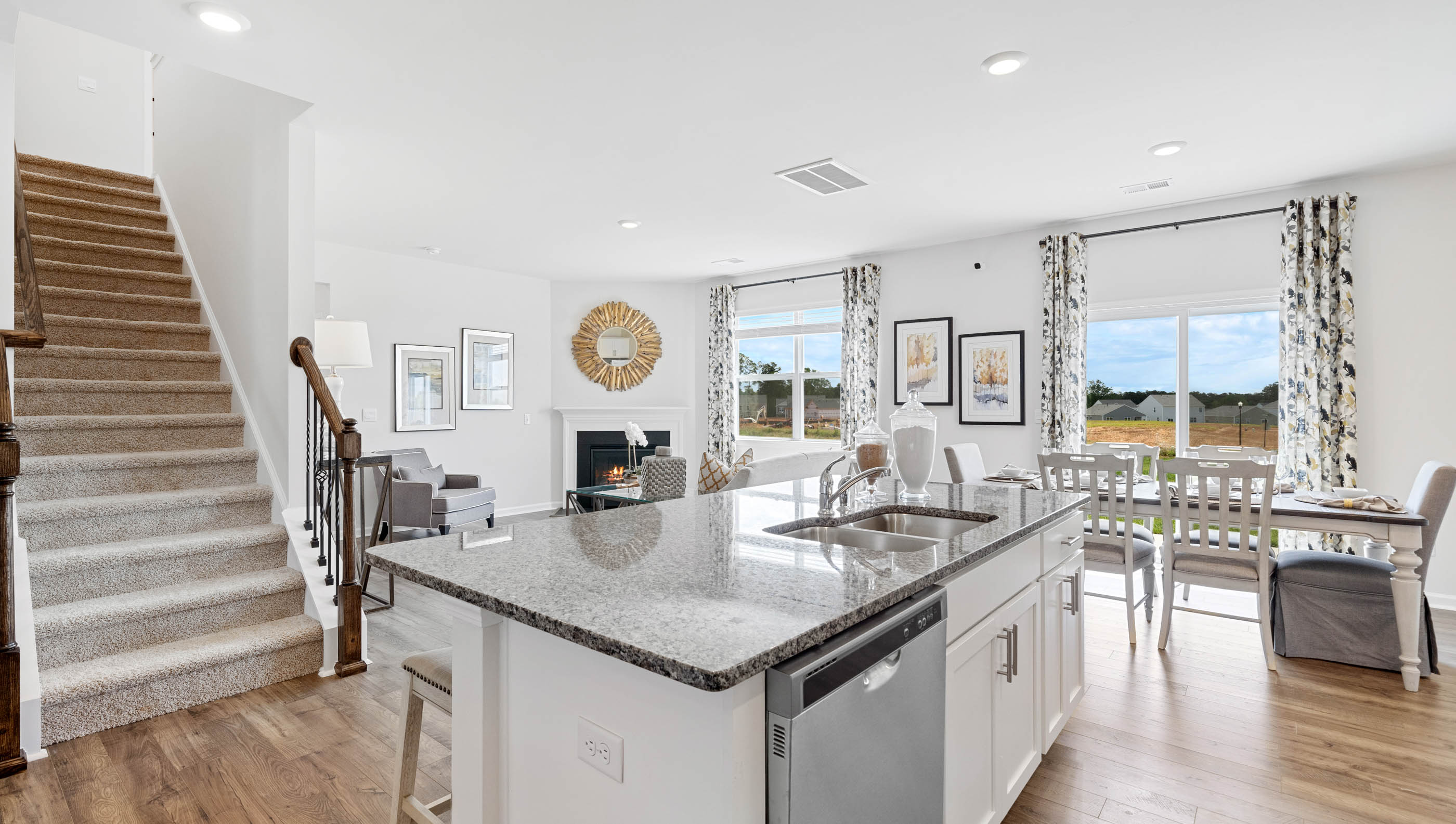 Kitchen and island with granite counter tops.