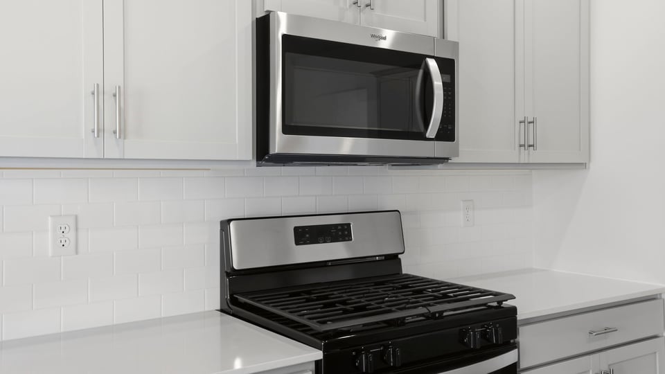 Kitchen with island and cabinets.