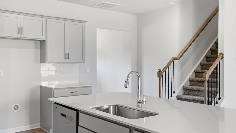 Kitchen with island and cabinets.