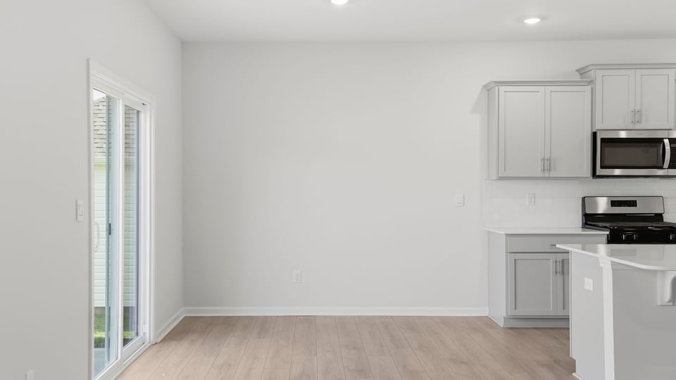 Kitchen with island and cabinets.