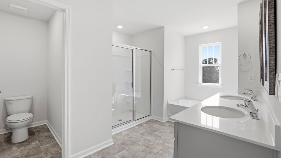 Primary bathroom with double vanity sink.