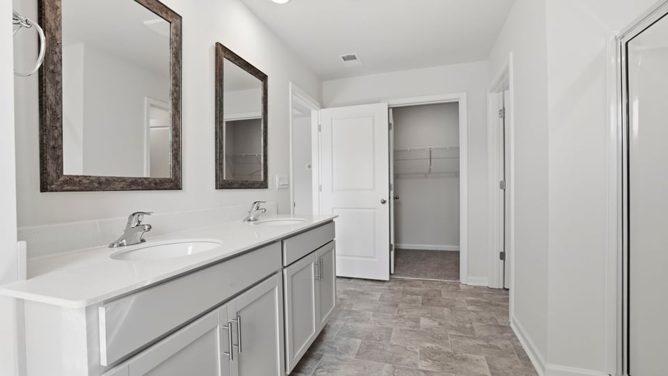 Primary bathroom with double vanity sink.