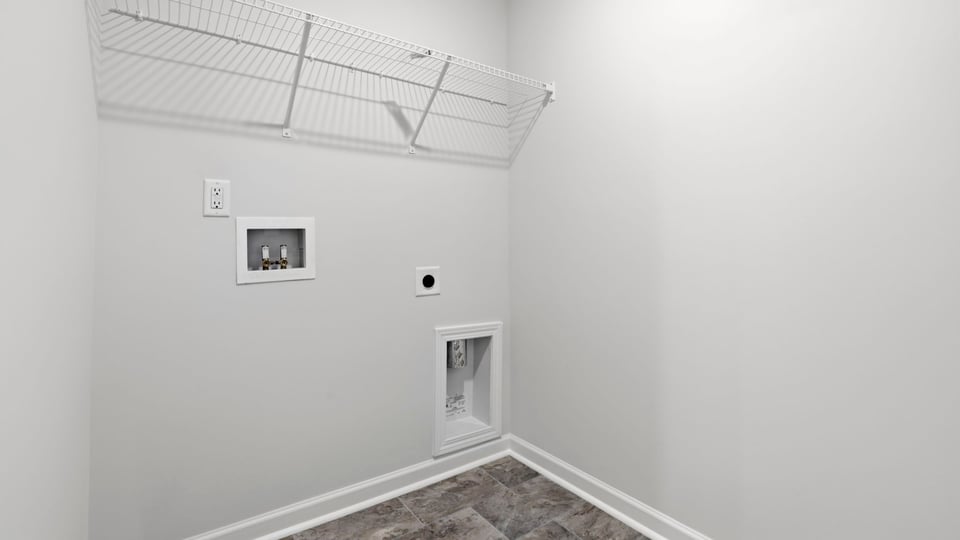 Laundry room with shelf.