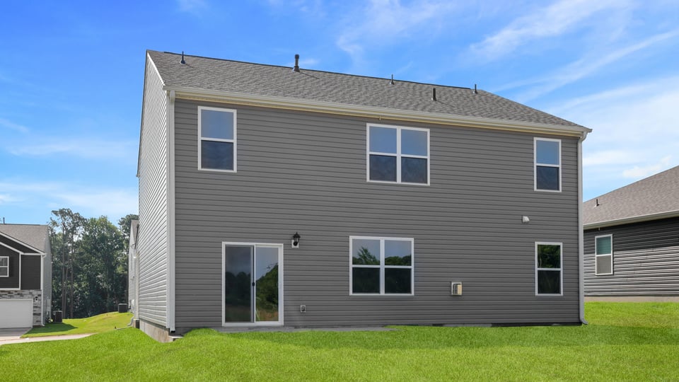 Back exterior with large backyard.