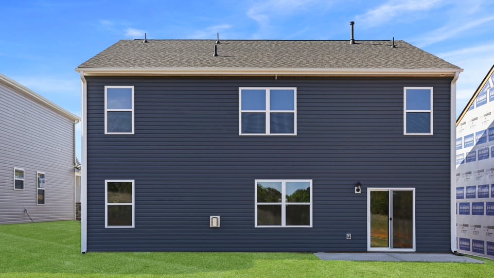 Back exterior with large backyard.