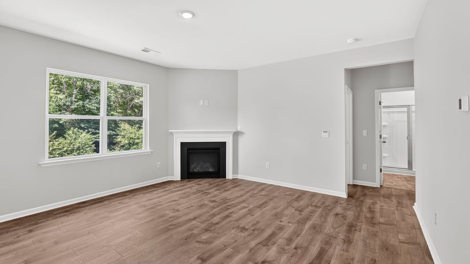 Family room with windows and fireplace.