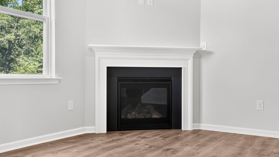 Family room with windows and fireplace.