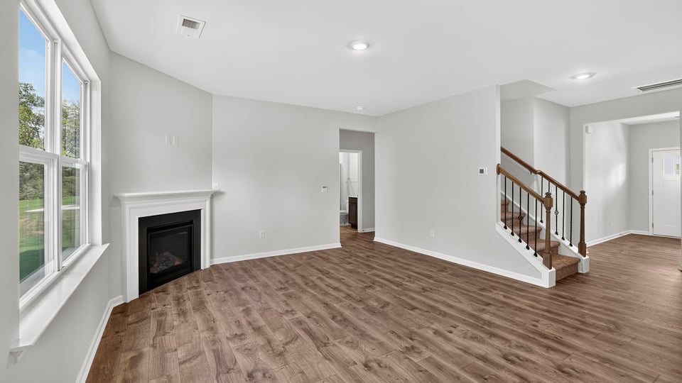 Family room with windows and fireplace.